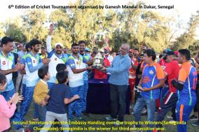 Second Secretary from the Embassy Handling over the trophy to Winners(Seneginida Champions).
